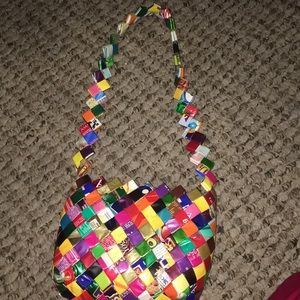 This is a purse made out of candy wrappers